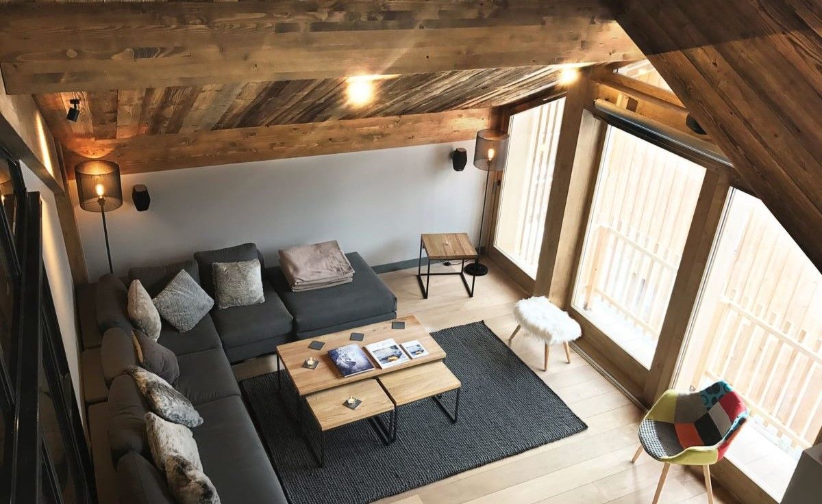 Chalet Caro, Meribel - lounge with large sofa and coffee table
